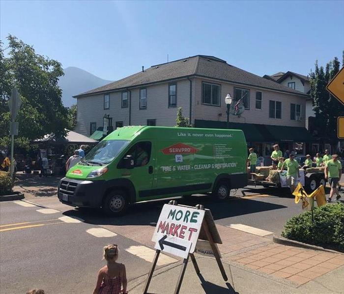 SERVPRO van in the street on parade route